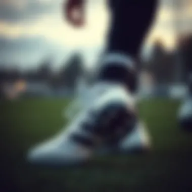 Player in action wearing adidas turf shoes on the field