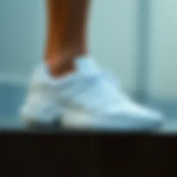 Adidas white ankle shoes showcasing sleek design