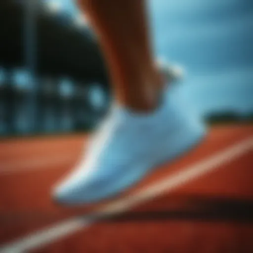 Stylish white running shoes on a track