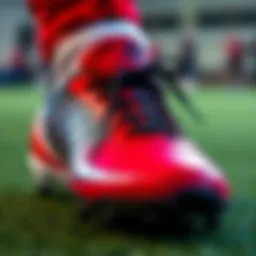 Detailed inspection of a soccer shoe's features.