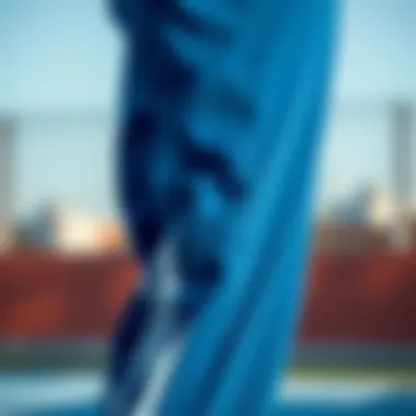 Close-up of high-quality fabric used in blue Adidas tracksuit bottoms