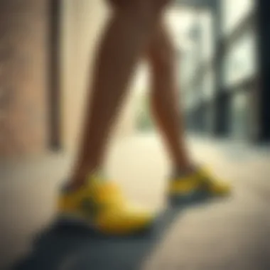 Person stretching in New Balance yellow shoes before a workout