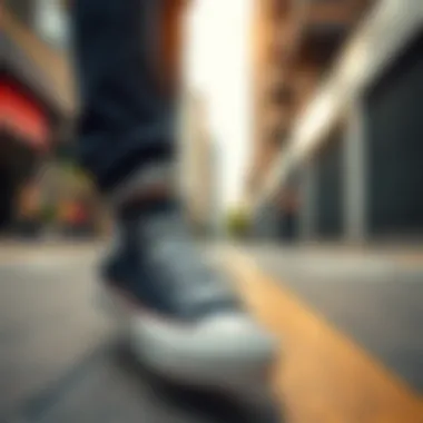 A stylish individual wearing black Converse Chuck Taylor in an urban setting