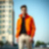 A stylish orange jacket paired with neutral trousers